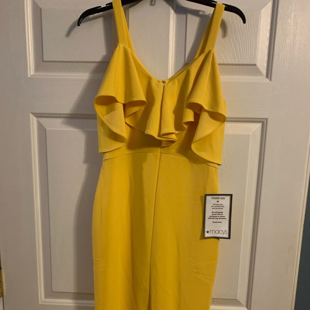Bright yellow off the shoulder dress but has straps never worn comes below knee